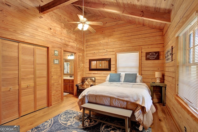 2425 Hines Gap Rd, Warm Springs, GA 31830 - bedroom with wood walls, wooden ceiling, light wood-style floors, a sink, and connected bathroom