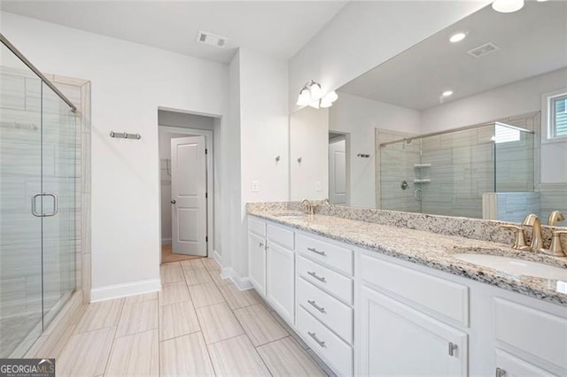 1809 Hanwoo Ln, Powder Springs, GA 30127 - bathroom featuring a shower stall, double vanity, baseboards, and recessed lighting