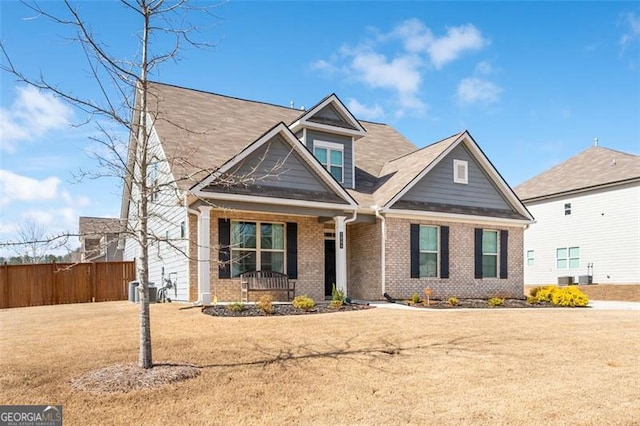 1809 Hanwoo Ln, Powder Springs, GA 30127 - craftsman-style home with covered porch, brick siding, and cooling unit
