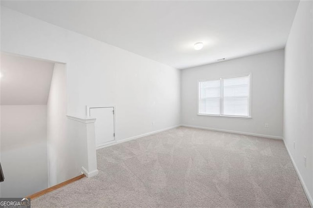 1809 Hanwoo Ln, Powder Springs, GA 30127 - carpeted empty room with baseboards