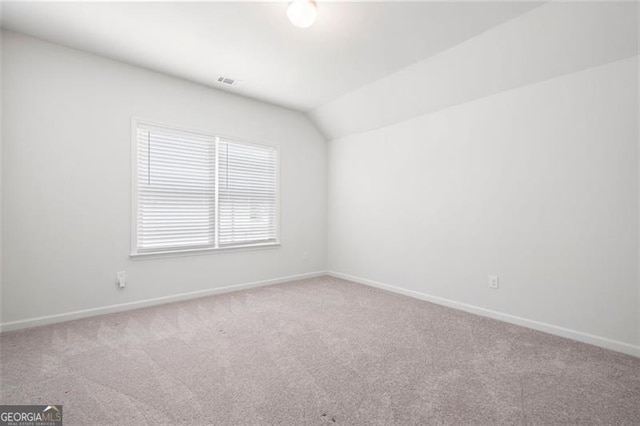 1809 Hanwoo Ln, Powder Springs, GA 30127 - carpeted empty room featuring baseboards and vaulted ceiling