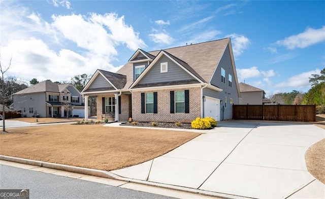 1809 Hanwoo Ln, Powder Springs, GA 30127 - view of front of house featuring concrete driveway, fence, a garage, and brick siding