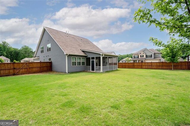 1809 Hanwoo Ln, Powder Springs, GA 30127 - rear view of property with a sunroom