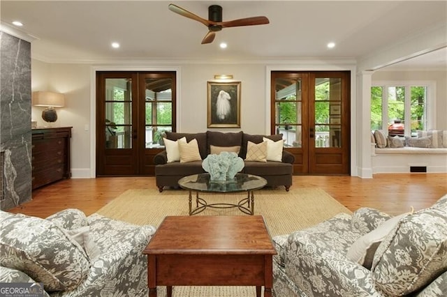 living room with french doors, ornamental molding, wood finished floors, ceiling fan, and recessed lighting
