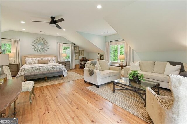 bedroom featuring lofted ceiling, wood finished floors, recessed lighting, and a ceiling fan