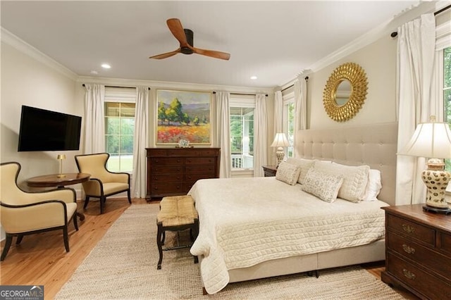 bedroom with crown molding, light wood finished floors, recessed lighting, and a ceiling fan