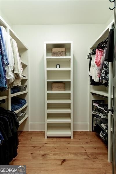 walk in closet featuring light wood-type flooring