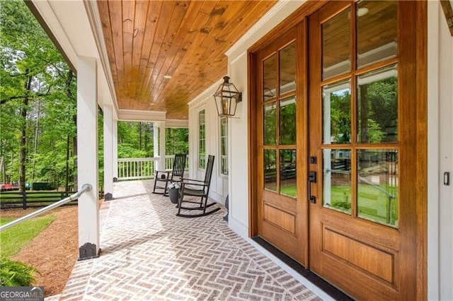 doorway to property featuring a porch