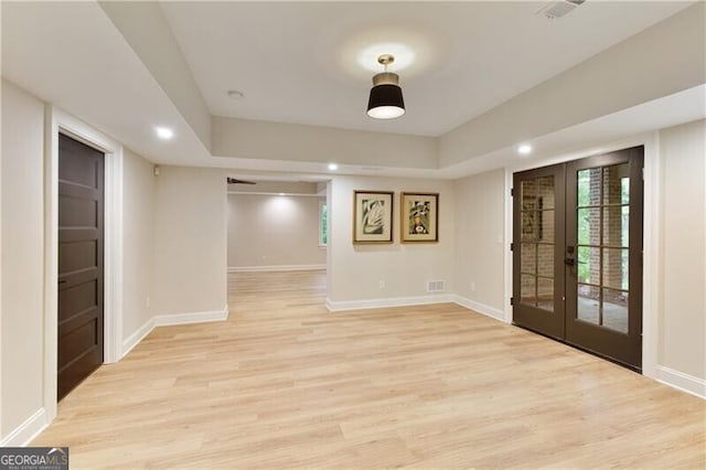 foyer entrance featuring french doors, light wood finished floors, baseboards, and recessed lighting