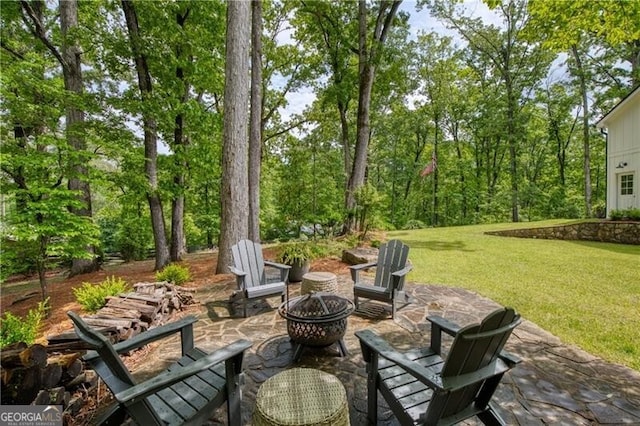view of patio with an outdoor fire pit