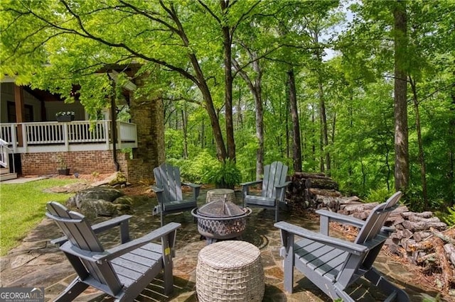 view of patio with a fire pit
