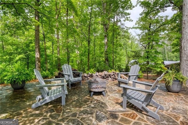view of patio / terrace with an outdoor fire pit