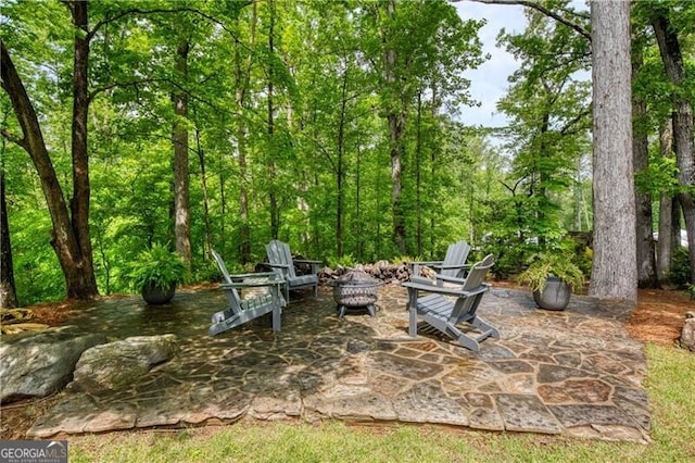 view of patio featuring an outdoor fire pit
