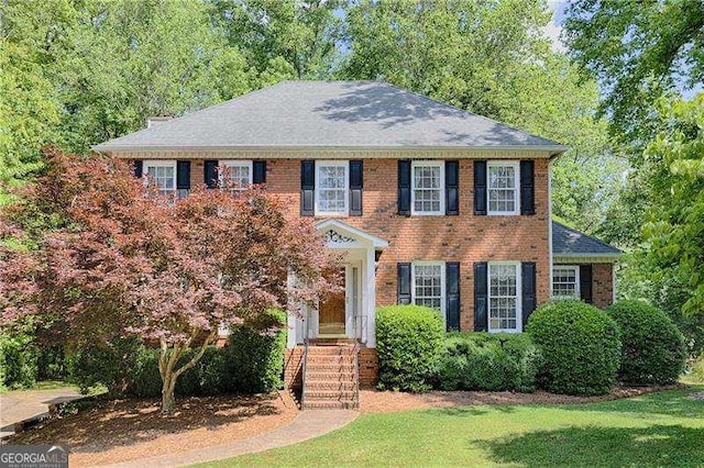 3625 Stonehenge Way NE, Marietta, GA 30066 - colonial house featuring a front yard, brick siding, and roof with shingles