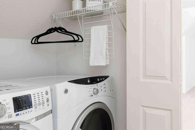 386 Collegiate Dr, Powder Springs, GA 30127 - clothes washing area with washing machine and dryer