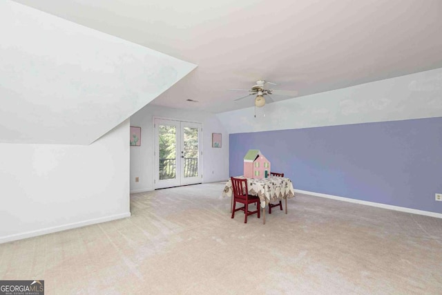 386 Collegiate Dr, Powder Springs, GA 30127 - rec room featuring french doors, lofted ceiling, carpet flooring, ceiling fan, and baseboards