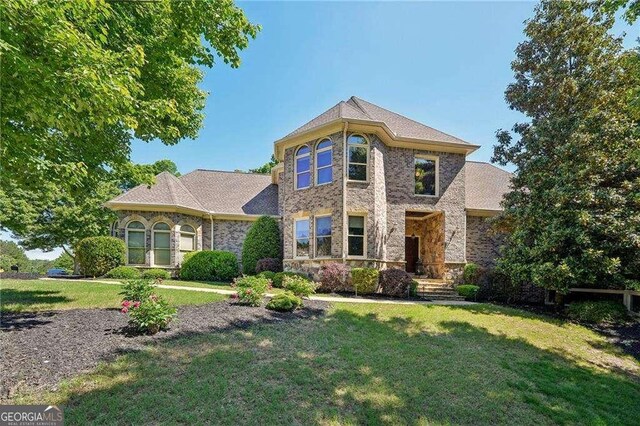 4162 Cumberland Point Dr, Gainesville, GA 30504 - view of front facade featuring a front yard and stone siding