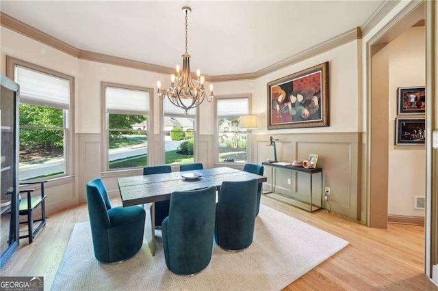 4162 Cumberland Point Dr, Gainesville, GA 30504 - dining space featuring a decorative wall, a chandelier, light wood-type flooring, ornamental molding, and healthy amount of natural light