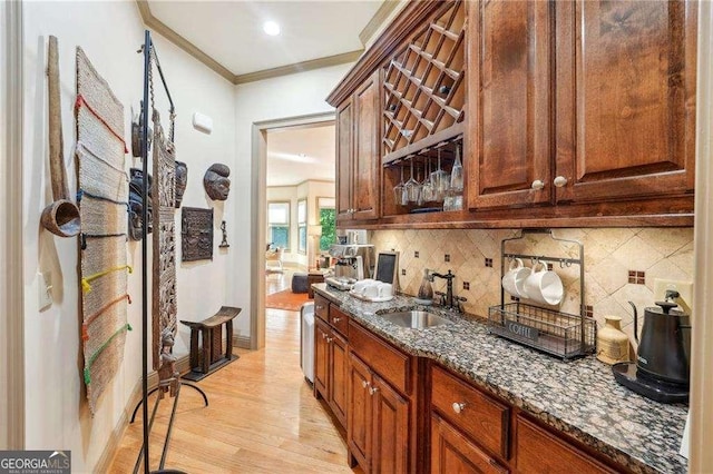 4162 Cumberland Point Dr, Gainesville, GA 30504 - bar area featuring a sink, light wood-style flooring, tasteful backsplash, and crown molding