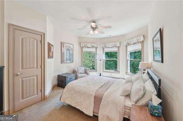 4162 Cumberland Point Dr, Gainesville, GA 30504 - carpeted bedroom featuring a ceiling fan and baseboards