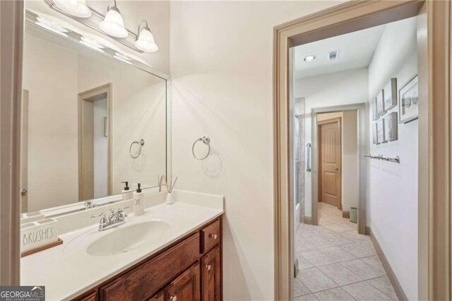 4162 Cumberland Point Dr, Gainesville, GA 30504 - bathroom with tile patterned floors, vanity, and baseboards