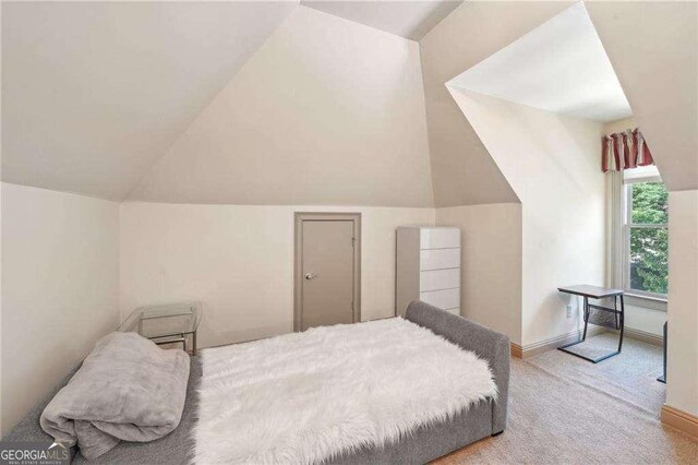 4162 Cumberland Point Dr, Gainesville, GA 30504 - bedroom featuring carpet flooring, vaulted ceiling, and baseboards