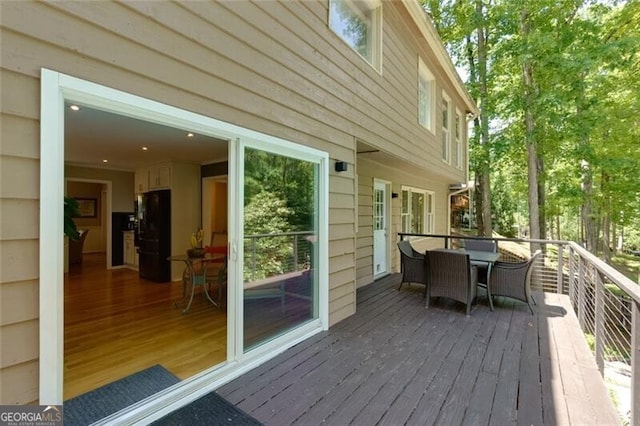 wooden deck with outdoor dining area
