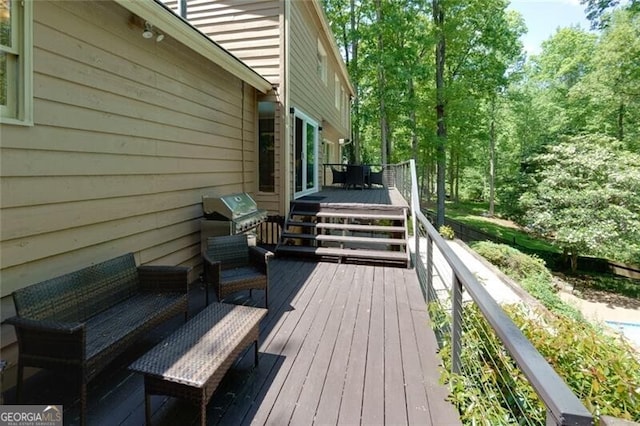 deck with area for grilling and an outdoor living space