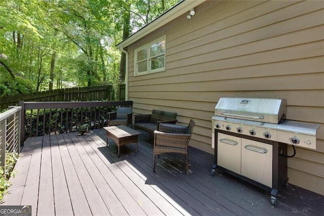 deck with fence and outdoor lounge area