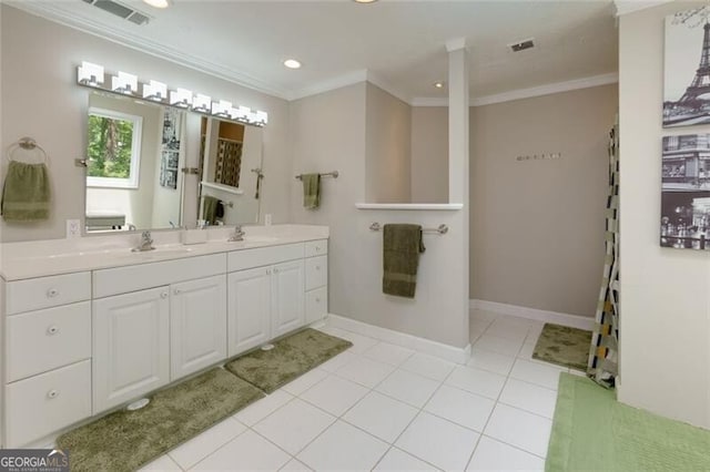 bathroom featuring crown molding, double vanity, recessed lighting, baseboards, and tile patterned flooring