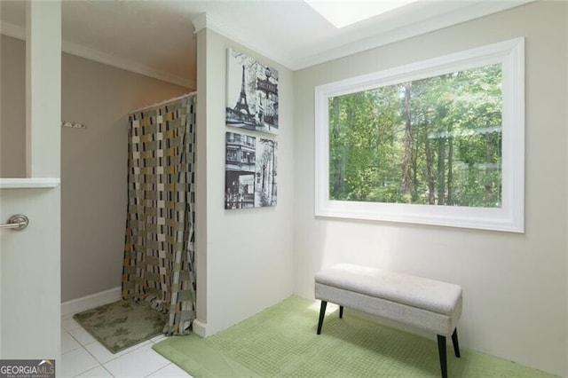 full bathroom with tiled shower, tile patterned floors, and ornamental molding