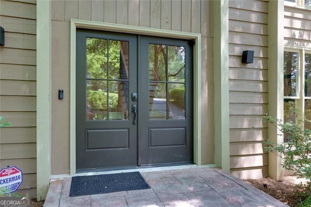 view of exterior entry featuring french doors