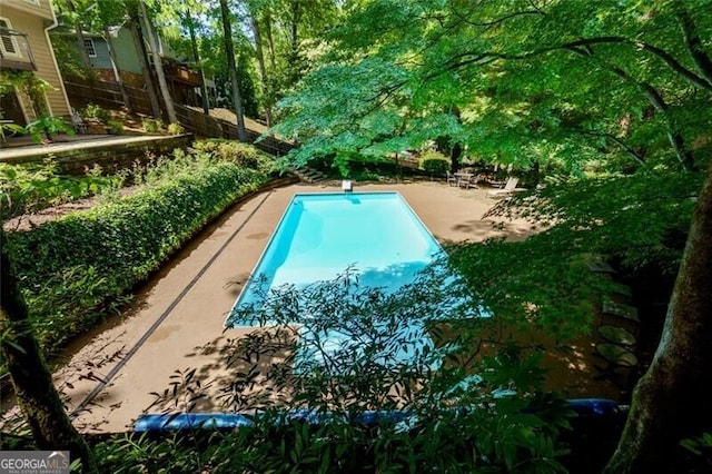 outdoor pool with a diving board