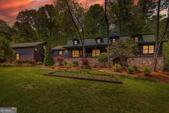 259 Eagle Chase Cir, Dillard, GA 30537 - rear view of property with stone siding, a lawn, covered porch, and metal roof