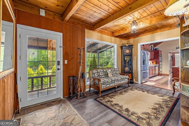 259 Eagle Chase Cir, Dillard, GA 30537 - living area featuring wooden ceiling, beamed ceiling, wood finished floors, wood walls, and a chandelier