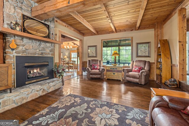 259 Eagle Chase Cir, Dillard, GA 30537 - living room featuring wood ceiling, hardwood / wood-style floors, beam ceiling, a stone fireplace, and a chandelier