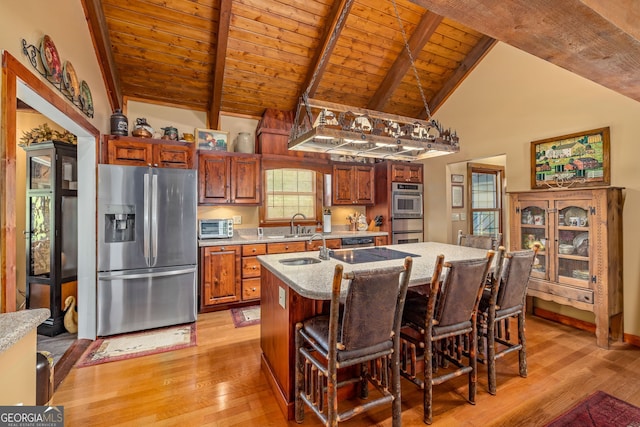 259 Eagle Chase Cir, Dillard, GA 30537 - kitchen with appliances with stainless steel finishes, wooden ceiling, light wood-style flooring, beamed ceiling, and an island with sink