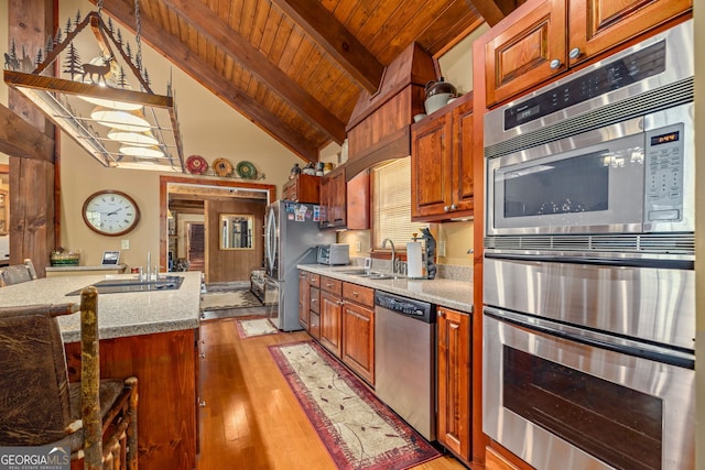 259 Eagle Chase Cir, Dillard, GA 30537 - kitchen featuring appliances with stainless steel finishes, light wood-style flooring, wooden ceiling, beam ceiling, and a sink
