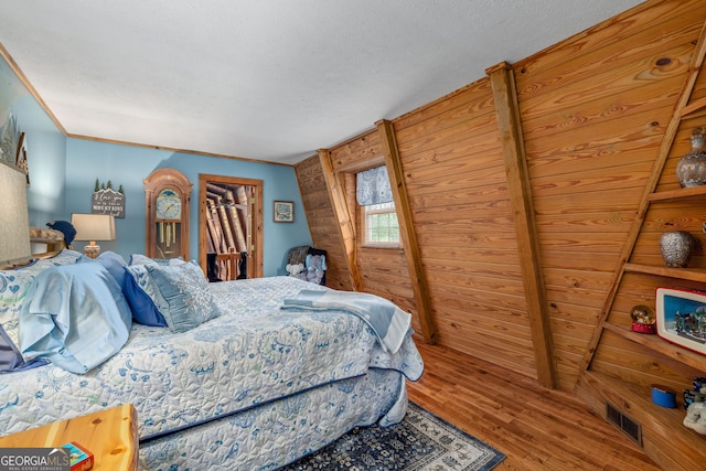 259 Eagle Chase Cir, Dillard, GA 30537 - bedroom with wood finished floors and a textured ceiling