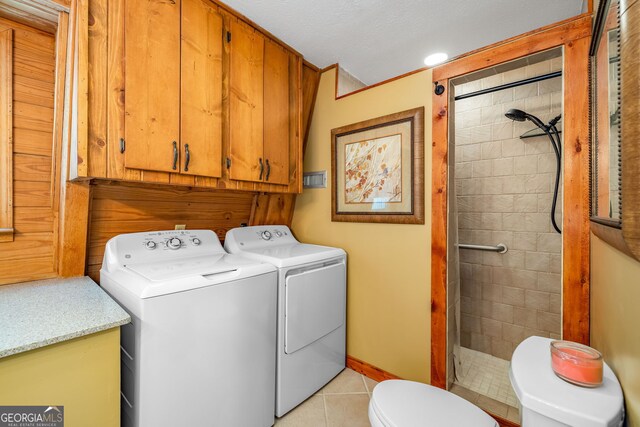 259 Eagle Chase Cir, Dillard, GA 30537 - laundry room with independent washer and dryer, light tile patterned flooring, cabinet space, and baseboards