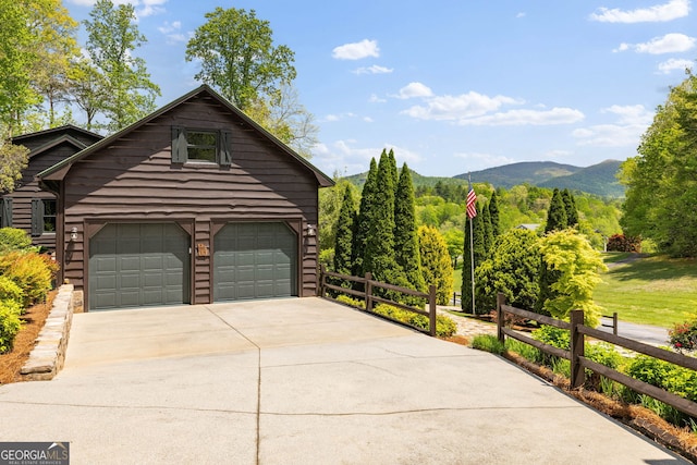 259 Eagle Chase Cir, Dillard, GA 30537 - view of side of property featuring a mountain view, fence, an attached garage, and driveway