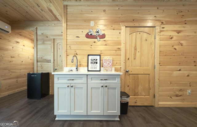 bar area with wood ceiling, dark wood-type flooring, wooden walls, an AC wall unit, and a sink