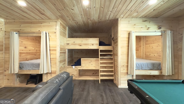 bedroom featuring wood walls, wooden ceiling, recessed lighting, dark wood-type flooring, and pool table