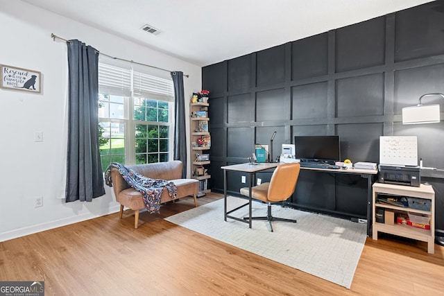 4104 Glenaire Way NW, Acworth, GA 30101 - home office featuring a decorative wall and light wood-type flooring