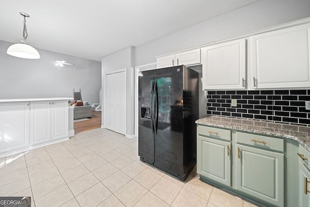 4104 Glenaire Way NW, Acworth, GA 30101 - kitchen featuring black refrigerator with ice dispenser, a ceiling fan, light tile patterned floors, backsplash, and white cabinets