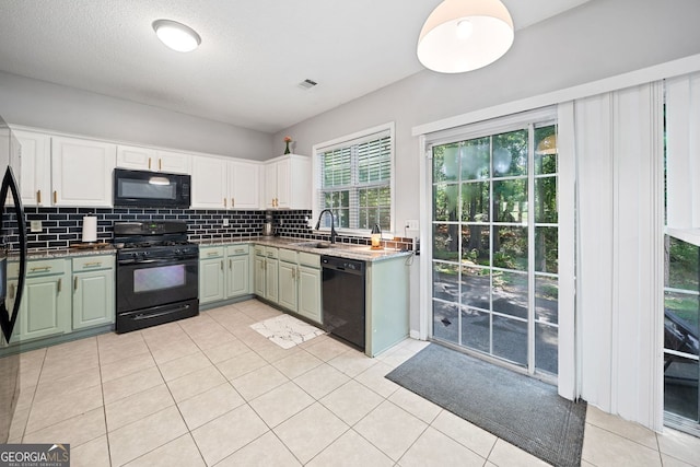 4104 Glenaire Way NW, Acworth, GA 30101 - kitchen with black appliances, backsplash, light tile patterned floors, and white cabinetry