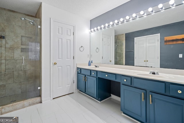 4104 Glenaire Way NW, Acworth, GA 30101 - bathroom featuring double vanity, a stall shower, a textured ceiling, and marble look tiles