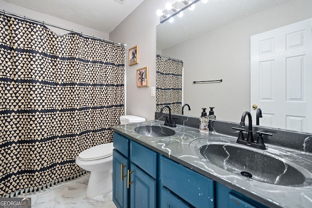 4104 Glenaire Way NW, Acworth, GA 30101 - bathroom with marble look tiles, double vanity, and a textured ceiling