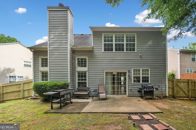 4104 Glenaire Way NW, Acworth, GA 30101 - back of house featuring a chimney, a patio, and a fenced backyard
