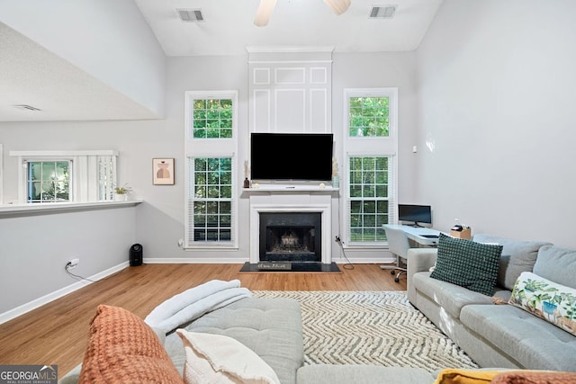 4104 Glenaire Way NW, Acworth, GA 30101 - living area with a ceiling fan, wood finished floors, and a fireplace with raised hearth